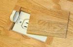 Hand-crafted wood cover conceals unsightly and potentially dangerous floor outlets ...